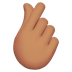 Bagaimana Hand with Index Finger and Thumb Crossed: Medium Skin Tone emoji terlihat di Apple.