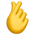 Bagaimana Hand with Index Finger and Thumb Crossed emoji terlihat di Apple.