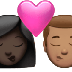 Bagaimana emoji Cium: perempuan, lelaki, ton kulit gelap dan ton kulit sederhana kelihatan di Apple.