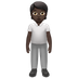 Bagaimana Person Standing: Dark Skin Tone emoji terlihat di Apple.