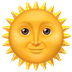 Bagaimana Sun with Face emoji terlihat di Apple.