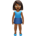 Bagaimana Woman Standing: Medium-Dark Skin Tone emoji terlihat di Apple.