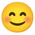 Cómo se ve el emoji Cara feliz con ojos sonrientes en Google.