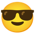 Cómo se ve el emoji Cara sonriendo con gafas de sol en Google.