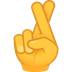 Bagaimana Crossed Fingers emoji terlihat di Joypixels.