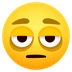 Hur Ansikte med påsar under ögonen emoji ser ut på Joypixels.