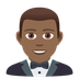 How Man in Tuxedo: Medium-Dark Skin Tone emoji looks on Joypixels.