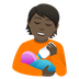 Bagaimana Person Feeding Baby: Dark Skin Tone emoji terlihat di Joypixels.