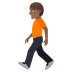 How Person Walking: Medium-Dark Skin Tone emoji looks on Joypixels.