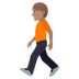 Bagaimana Person Walking: Medium Skin Tone emoji terlihat di Joypixels.