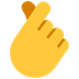 Bagaimana Hand with Index Finger and Thumb Crossed emoji terlihat di Microsoft.