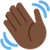 How Waving Hand: Dark Skin Tone emoji looks on Twitter.