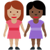 Como o emoji do Duas mulheres de mãos dadas: pele morena e pele escura é exibido no Twitter.