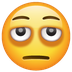 Jak wygląda emoji Twarz z workami pod oczami w Whatsapp.