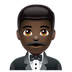 How Man in Tuxedo: Dark Skin Tone emoji looks on Whatsapp.