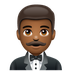 Bagaimana Man in Tuxedo: Medium-Dark Skin Tone emoji terlihat di Whatsapp.