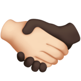 How Handshake: Light Skin Tone, Dark Skin Tone emoji looks on Apple.