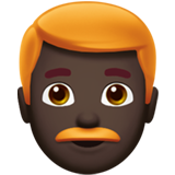 A quoi ressemblent les emoji Homme: peau foncée et cheveux roux sur Apple.