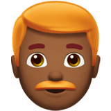 How Man: Medium-Dark Skin Tone, Red Hair emoji looks on Apple.