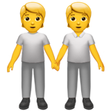 Hoe Personen hand in hand emoji eruit ziet op Apple.