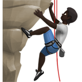 How Person Climbing: Dark Skin Tone emoji looks on Apple.