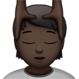 How Person Getting Massage: Dark Skin Tone emoji looks on Apple.