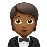 How Person in Tuxedo: Medium-Dark Skin Tone emoji looks on Apple.