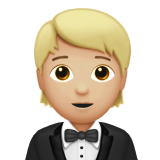 How Person in Tuxedo: Medium-Light Skin Tone emoji looks on Apple.