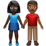 A quoi ressemblent les emoji Femme et homme se tenant la main: peau foncée et peau mate sur Apple.