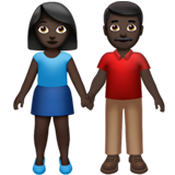 A quoi ressemblent les emoji Femme et homme se tenant la main: peau foncée sur Apple.