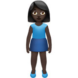 How Woman Standing: Dark Skin Tone emoji looks on Apple.