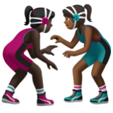 A quoi ressemblent les emoji Lutteuses : peau foncée et peau mate sur Apple.