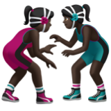 A quoi ressemblent les emoji Lutteuses : peau foncée sur Apple.