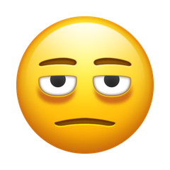 Bagaimana Wajah dengan kantung mata emoji terlihat di Emojipedia.