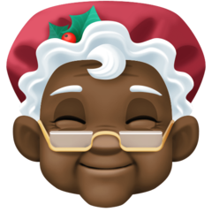 Cómo se ve el emoji Mamá Noel: tono de piel oscuro en Facebook.