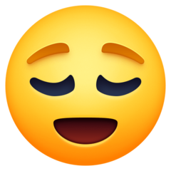 Como o emoji do Rosto aliviado é exibido no Facebook.