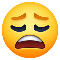 How Weary Face emoji looks on Facebook.