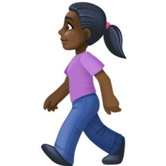 Bagaimana Woman Walking: Dark Skin Tone emoji terlihat di Facebook.