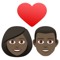 Bagaimana emoji Pasangan dengan simbol hati: perempuan, lelaki dan ton kulit gelap kelihatan di Joypixels.