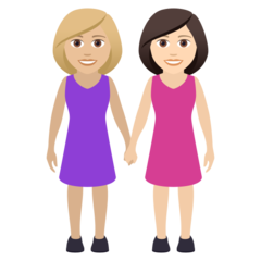 A quoi ressemblent les emoji Deux femmes se tenant la main: peau moyennement claire et peau claire sur Joypixels.