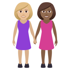 A quoi ressemblent les emoji Deux femmes se tenant la main: peau moyennement claire et peau mate sur Joypixels.