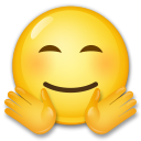 Jak wygląda emoji Twarz z gestem przytulania w Lg.