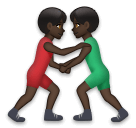 A quoi ressemblent les emoji Lutteurs : peau foncée sur Lg.