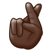 How Crossed Fingers: Dark Skin Tone emoji looks on Samsung.