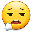 How Face Exhaling emoji looks on Samsung.