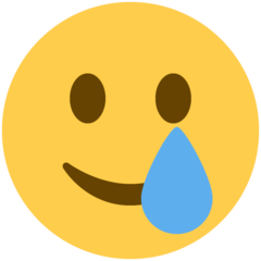 Cómo se ve el emoji Cara sonriente con lágrima en Twitter.