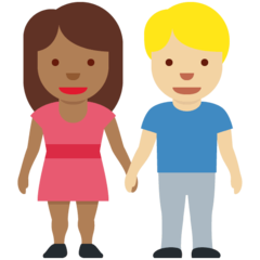 A quoi ressemblent les emoji Femme et homme se tenant la main: peau mate et peau moyennement claire sur Twitter.