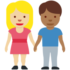 A quoi ressemblent les emoji Femme et homme se tenant la main: peau moyennement claire et peau mate sur Twitter.