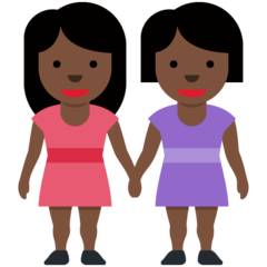 How Women Holding Hands: Dark Skin Tone emoji looks on Twitter.