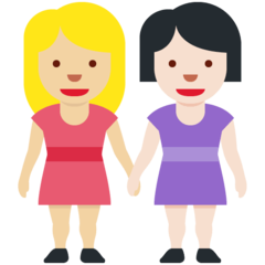 A quoi ressemblent les emoji Deux femmes se tenant la main: peau moyennement claire et peau claire sur Twitter.